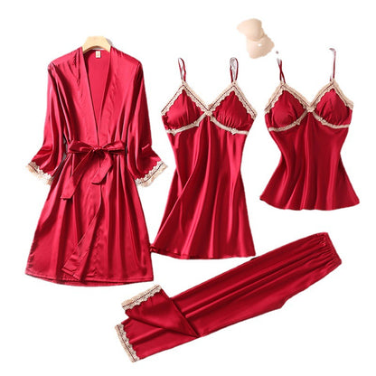 Teal silk sleepwear set featuring a robe, nightgown, camisole, and long pants with delicate white lace trim—luxurious, soft, and perfect for sleep and lounge.