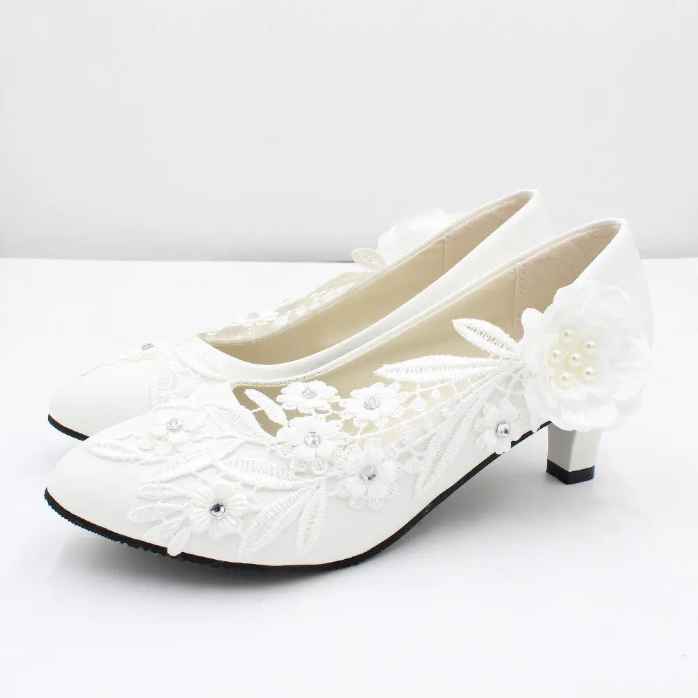 Romantic floral lace heels crafted to order for your special day.