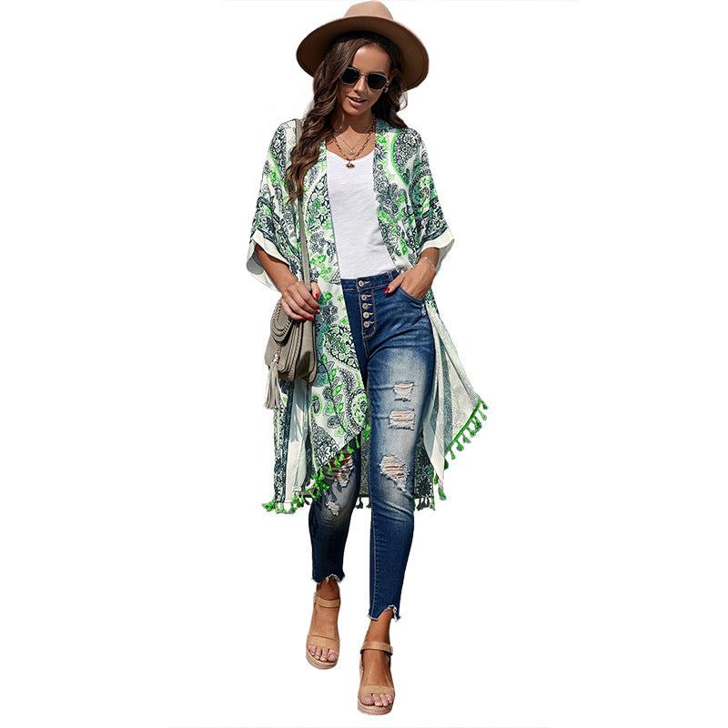 Rust-colored boho kimono-style cover-up with white intricate patterns and tassel detailing—lightweight, flowy, and perfect for summer layering.