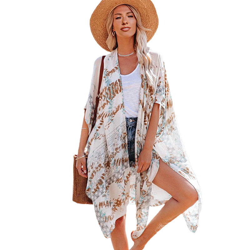 Rust-colored boho kimono-style cover-up with white intricate patterns and tassel detailing—lightweight, flowy, and perfect for summer layering.