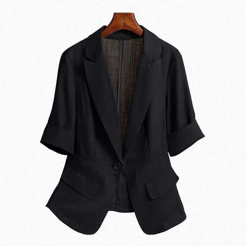 Black tailored blazer with a single-button closure, structured shoulders, front flap pockets, and rolled-up sleeves—modern, elegant, and perfect for office or casual styling.