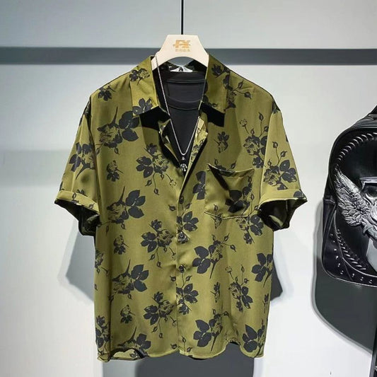 Stylish floral short-sleeve shirt available in black and army green – featuring a bold beige floral print, soft breathable fabric, and effortless styling