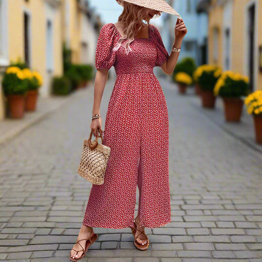 Elegant black floral jumpsuit with square neckline, puffed short sleeves, and wide-leg pants – stylish, breathable, and perfect for casual or chic occasions.