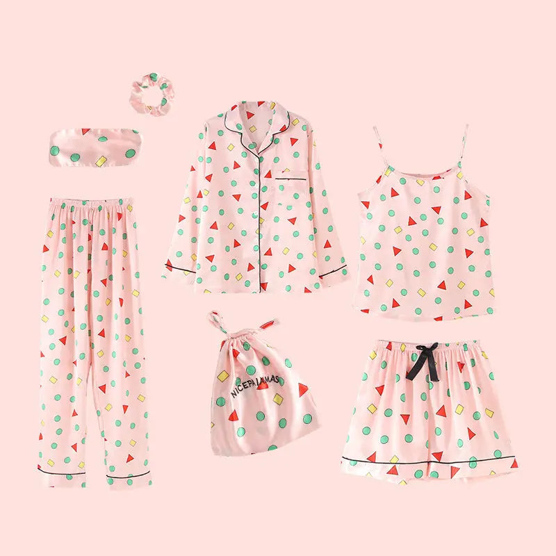 Luxury silk sleepwear set featuring a robe, nightgown, camisole, and long pants with delicate white lace trim—elegant, soft, and perfect for sleep and lounge.