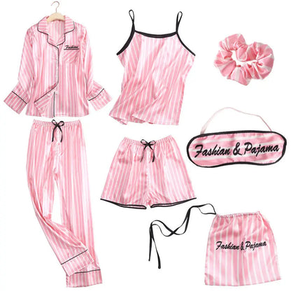 Luxury silk sleepwear set featuring a robe, nightgown, camisole, and long pants with delicate white lace trim—elegant, soft, and perfect for sleep and lounge.