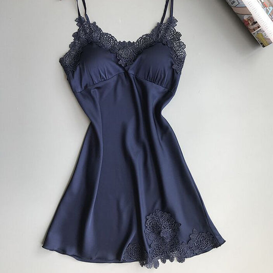 Sleeveless nightdress with lace detailing around the neckline and hem, displayed on a wooden hanger against a gray background—sexy, elegant, and perfect for homewear.