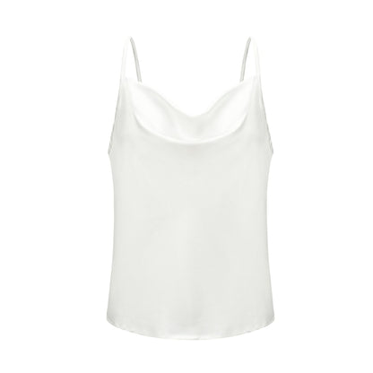 White satin camisole top, styled with a light blue denim skirt, holding a branch with green leaves—modern, elegant, and perfect for casual or dressy looks.