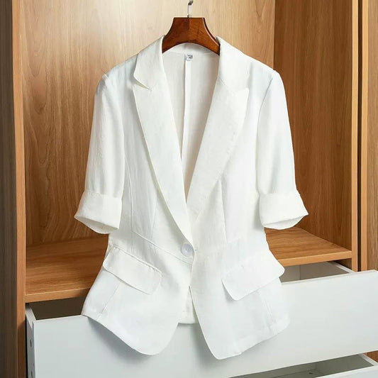 White tailored blazer with a single-button closure, structured shoulders, front flap pockets, and rolled-up sleeves—modern, elegant, and perfect for office or casual styling.