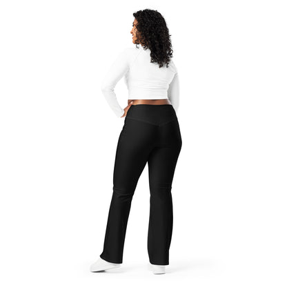 Person wearing black leggings paired with a beige crop top, white button-up jacket, and white sneakers—modern, stylish, and perfect for casual fashion.