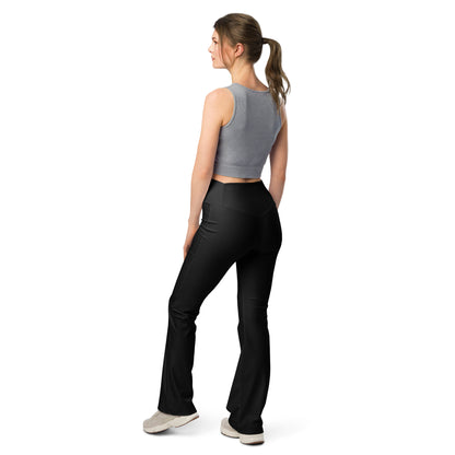 Person wearing black leggings paired with a beige crop top, white button-up jacket, and white sneakers—modern, stylish, and perfect for casual fashion.