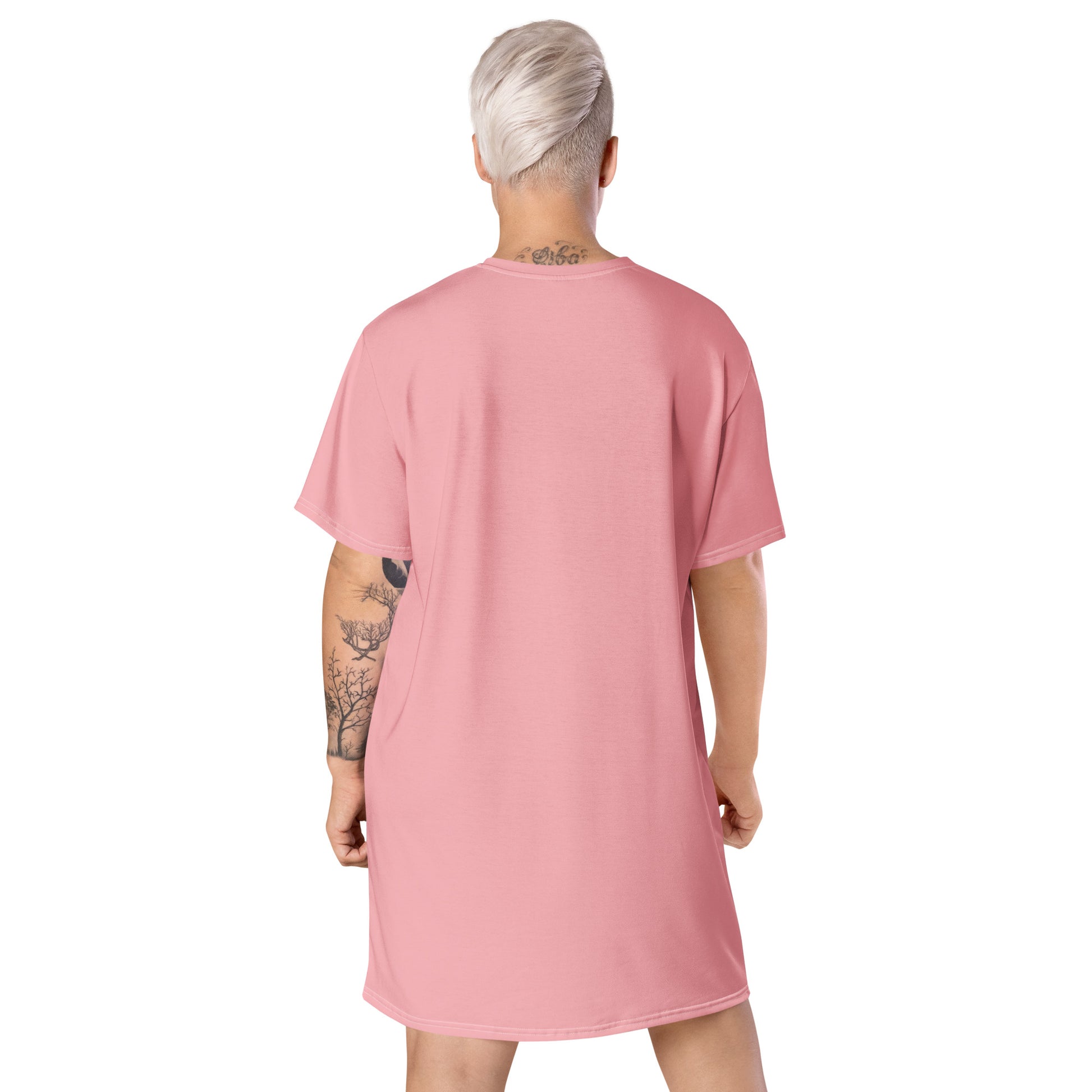 Pink oversized t-shirt dress featuring a distressed Union Jack graphic on the front, paired with black boots—stylish, edgy, and perfect for casual streetwear.