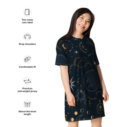 Person wearing a dark celestial-themed t-shirt dress featuring stars, moons, and planets, paired with sneakers—modern, artistic, and perfect for cosmic-inspired fashion.