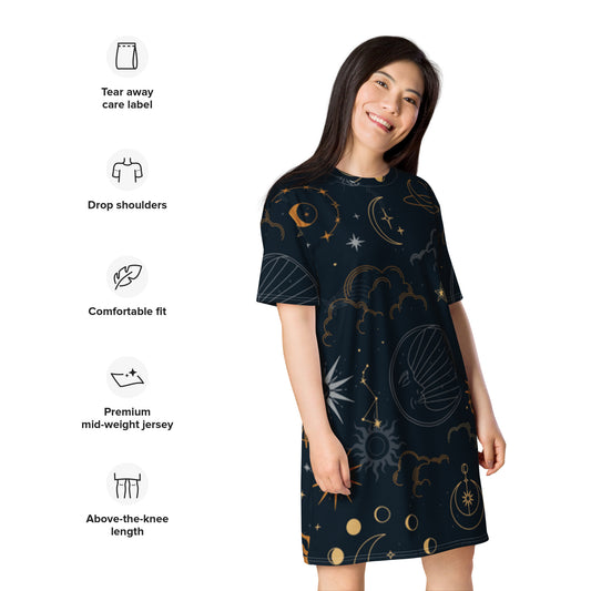 Person wearing a dark celestial-themed t-shirt dress featuring stars, moons, and planets, paired with sneakers—modern, artistic, and perfect for cosmic-inspired fashion.
