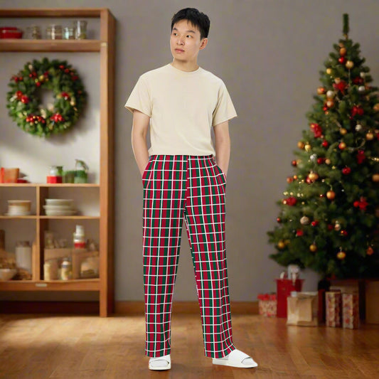 Person wearing red and green checkered Christmas pants, paired with a beige t-shirt and white shoes—festive, stylish, and perfect for holiday outfits.