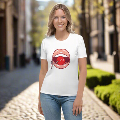 White t-shirt featuring a bold stylized lips and cherry graphic in red, paired with blue jeans—playful, stylish, and perfect for casual wear.
