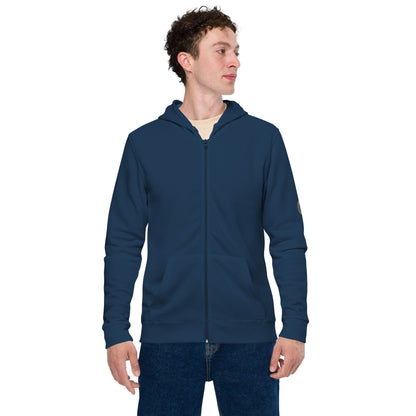 Person wearing a black zip-up hoodie featuring brushed fleece inside, kangaroo pockets, and a hood with matching drawstrings, paired with blue jeans—modern, comfortable, and perfect for athleisure styling.