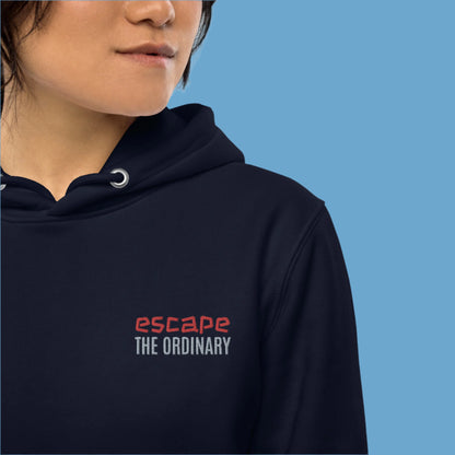 Minimalist street-style hoodie available in navy blue, black, and white, featuring a bold text design on the chest reading ‘escape’ in red and ‘THE ORDINARY’ in white, along with a front pocket and adjustable metal-tipped drawstring hood.
