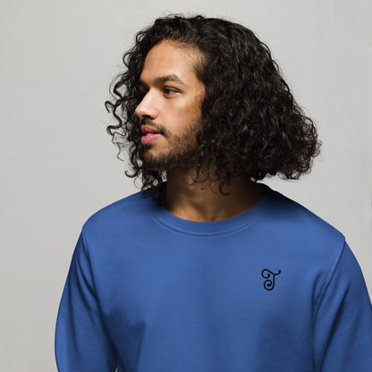 Royal blue sweatshirt featuring an embroidered letter ‘T’ on the left chest, worn with beige pants, seated on a black stool against a white background—modern, stylish, and available in multiple colors.