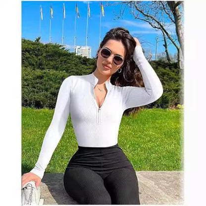 Woman wearing a sleek zip-up bodysuit with a front zipper detail, form-fitting long sleeves, available in pink and black—modern, versatile, and effortlessly stylish.
